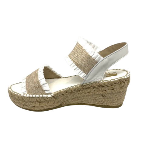 This tried and proven favourite espadrille has a 7cm rope wedge and the wide elasticized straps are finished with a small frill. A well fitted and comfortable sandal. Made in Spain.