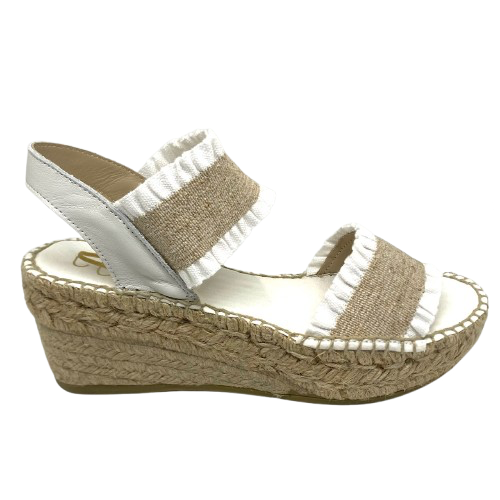 This tried and proven favourite espadrille has a 7cm rope wedge and the wide elasticized straps are finished with a small frill. A well fitted and comfortable sandal. Made in Spain.