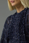 90% cotton 10% silk
Gathered ruffle layers with a deep bib
Full-length blouson sleeves
Lightweight ramie for relaxed elegance
Covered buttons run through the centre front