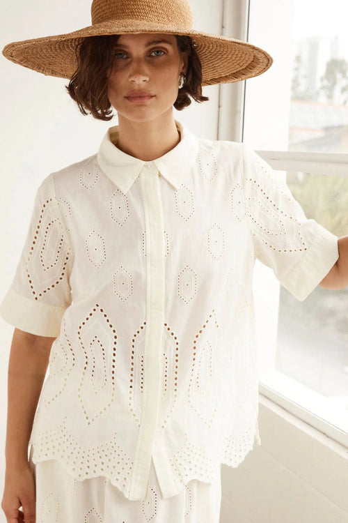 the pixel top in cream broderie is a refined yet versatile addition to any wardrobe. a simple minimalistic silhouette constructed in a feminine infused cotton broderie provides a salve to summer dressing. 