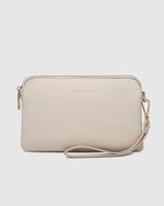 The Louenhide Poppy Clutch strikes the perfect balance between minimalism, versatility and style. She’s the ideal addition to your tote as a sleek clutch wallet or the perfect grab-and-go companion when carried by the wristlet. Designed in winter neutral soft-to-touch vegan leather, your essentials are organised in the backside pocket while held safe with the secure zip closures. Never go without your essentials and easily adapt to every occasion with the Poppy Clutch.