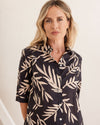 This easy to wear 100% soft cotton fabric of black with a beige leaf print is a great addition to your summer wardrobe. Brand is Seesaw.