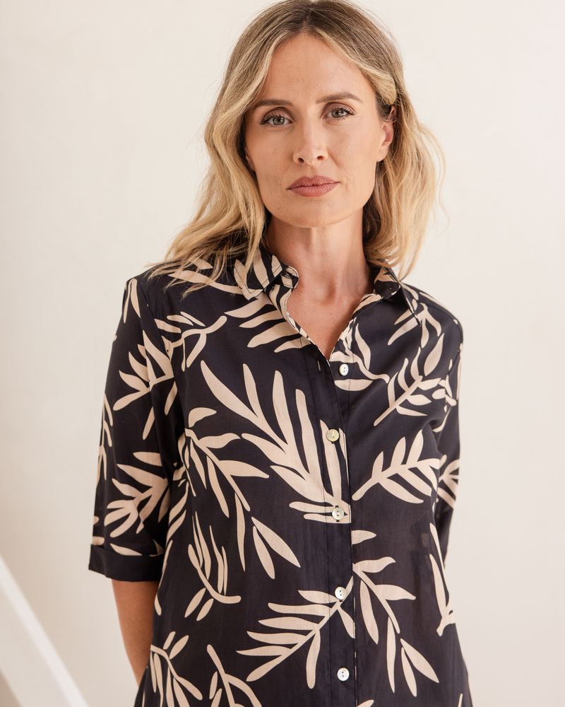 This easy to wear 100% soft cotton fabric of black with a beige leaf print is a great addition to your summer wardrobe. Brand is Seesaw.