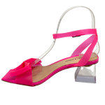 These vibrant fuchsia sandals are constructed of a pliable and soft vinylite finished with a cute bow and wrapped (and buckled) ankle strap. The toe shape is square and in a matching fuchsia patent leather. The clear shapely  block heel is 6.5cm. A very comfy little sandal from Django & Juliette.