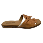 European made, this soft flat slide by Rilassare has a flexible sole, contoured footbed and a wide band of white leather over which is a twist of tan leather across the toes.