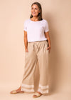 Discover refined summer styling in the Rio Pants. Crafted from a luxurious linen and cotton blend, these long pants promise comfort and sophistication. Complete with a thick stretch waistband and drawstring, Rio promises a flattering fit on any silhouette. Elevate Rio with a crisp white shirt and loafers for a polished daytime ensemble, or team with a silky blouse and statement accessories for an upscale evening affair.