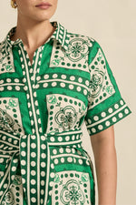 sustainably printed our exclusive parrot scarf print, a spirited exploration of hue and european-inspired graphic motif. the roam dress is perfect for resort styling or everyday luxury.

100% linen
crisp collar and covered placket deliver refined finish
custom zk exclusive parrot scarf print
wide self-tie belt for tailored shape
side split and relaxed fit offer comfort and movement
finished hem and sleeve trim for elevated detail
vacation-ready and trans-seasonal