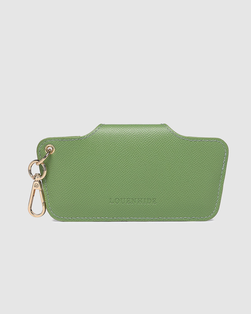 The Louenhide Skittle Sunglass Case is the perfect blend of style and functionality for your everyday eyewear. For ultimate convenience, effortlessly attach to your keys or handbag with the light gold hardware keyring clasp. Without compromising on style, the exterior features a gorgeous vegan leather, while the interior is lined with soft suede material to keep your everyday eyewear protected. Whether it's your favourite sunglasses or your reading glasses, they will stay protected and safe with the secure 