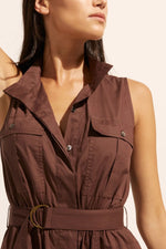 The Snippet is a sleeveless interpretation of classic shirt dress with a considered twist. Oversized patch pockets and D ring detail on the self-fabric belt add a utilitarian edge. This elongated silhouette has an elasticated waist that moves into an A-line skirt. the Snippet is a confident choice. 