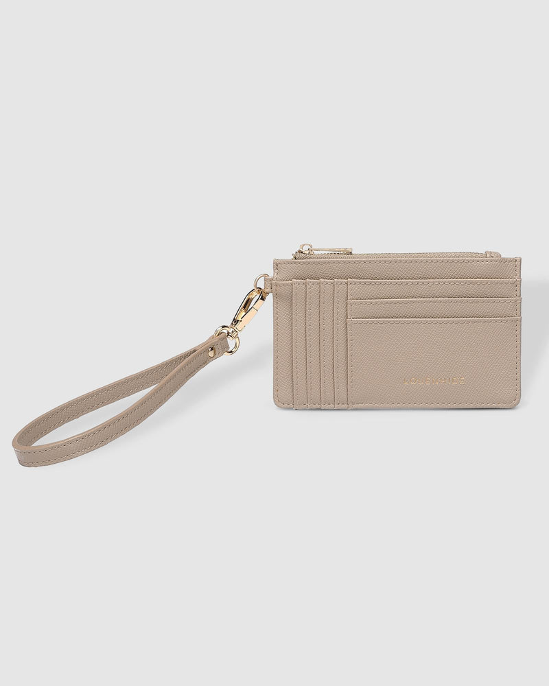 The Louenhide Tahlia Cardholder is the ultimate functional accessory featuring multiple card slots, note pockets, and a zipped coin pocket. This compact card-carrier is convenient and organised, complete with a detachable wristlet, grab and go for your night out, or place in your handbag for everyday use. Slim-line and vegan leather.