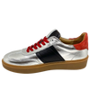 This cool little leather sneaker has a gum sole and silver outer with black side stripes, red suede at the heel land red laces.