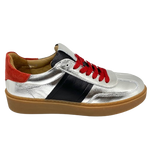 This cool little leather sneaker has a gum sole and silver outer with black side stripes, red suede at the heel land red laces.