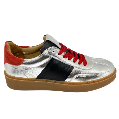 This cool little leather sneaker has a gum sole and silver outer with black side stripes, red suede at the heel land red laces.