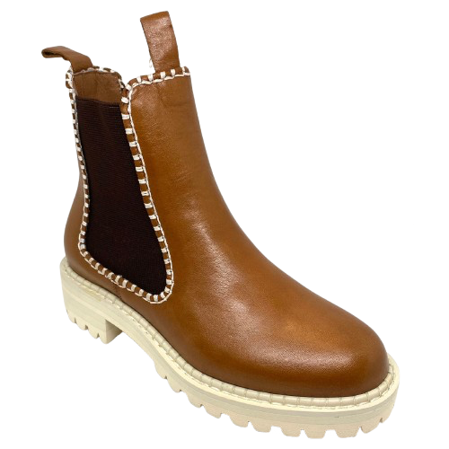 This gorgeous little ankle boot comes in a rich brandy coloured leather, has chocolate elastic in the sides, features white blanket stitching which ties in with the white chunky sole. Made by Bresley.