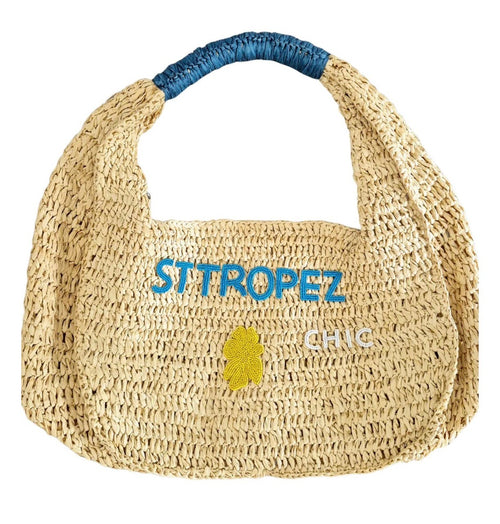 This large raffia bag measures 40cm x 25cm x 23cm, is semi circular in shape, has zip entry and it's single wide handle is wrapped in blue raffia. "St Tropez" is beaded in blue on the front,