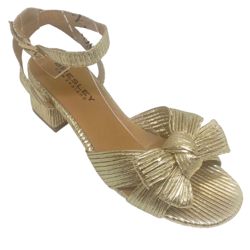 mid heel gold sandal with bow and ankle strap by Bresley