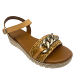 Made in Spain by Zeta, this comfortable low wedged sandal has a leather Y back with buckle, a raffia plaited strap across the toe and a "metallic" looking plastic chain trim. The natural colour of camel is an easy fit in any wardrobe.