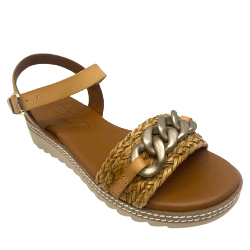 Made in Spain by Zeta, this comfortable low wedged sandal has a leather Y back with buckle, a raffia plaited strap across the toe and a "metallic" looking plastic chain trim. The natural colour of camel is an easy fit in any wardrobe.