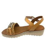 Made in Spain by Zeta, this comfortable low wedged sandal has a leather Y back with buckle, a raffia plaited strap across the toe and a "metallic" looking plastic chain trim. The natural colour of camel is an easy fit in any wardrobe.