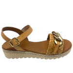 Made in Spain by Zeta, this comfortable low wedged sandal has a leather Y back with buckle, a raffia plaited strap across the toe and a "metallic" looking plastic chain trim. The natural colour of camel is an easy fit in any wardrobe.