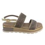 A low summer wedge by Django &amp; Juliette in mocha raffia with a gold trim. It features two bands across the foot and a gold leather back strap. A neutral but interesting and comfortable summer sandal.