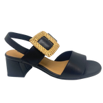 Black leather sandal with a 6cm block heel offering good support and foot coverage. The feature is a large raffia covered buckle on the strap across the instep.