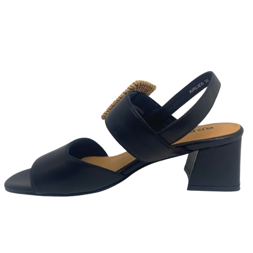 Black leather sandal with a 6cm block heel offering good support and foot coverage. The feature is a large raffia covered buckle on the strap across the instep.