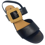 Black leather sandal with a 6cm block heel offering good support and foot coverage. The feature is a large raffia covered buckle on the strap across the instep.