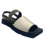 A quirky Japanese inspired sandal in soft patent leathers of off white and khaki. The soft rubber sole has a unique "squared off" appearance. A comfortable and versatile choice for those wanting something a little different.