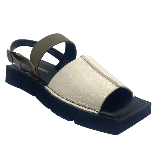 A quirky Japanese inspired sandal in soft patent leathers of off white and khaki. The soft rubber sole has a unique "squared off" appearance. A comfortable and versatile choice for those wanting something a little different.