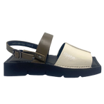A quirky Japanese inspired sandal in soft patent leathers of off white and khaki. The soft rubber sole has a unique "squared off" appearance. A comfortable and versatile choice for those wanting something a little different.