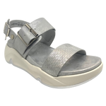 Super comfy and stylish, you'll have this sandal on high repeat all summer. Made with man made materials, it has a super comfy footbed with arch support and is adjustable across the instep and around the heel. The soft metallic finish has a skin pattern on the front strap and metallic detail on the wedge which both add to the look.