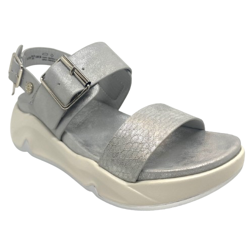 Super comfy and stylish, you'll have this sandal on high repeat all summer. Made with man made materials, it has a super comfy footbed with arch support and is adjustable across the instep and around the heel. The soft metallic finish has a skin pattern on the front strap and metallic detail on the wedge which both add to the look.