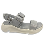 Super comfy and stylish, you'll have this sandal on high repeat all summer. Made with man made materials, it has a super comfy footbed with arch support and is adjustable across the instep and around the heel. The soft metallic finish has a skin pattern on the front strap and metallic detail on the wedge which both add to the look.