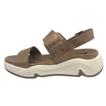 Super comfy and stylish, you'll have this sandal on high repeat all summer. Made with man made materials, it has a super comfy footbed with arch support and is adjustable across the instep and around the heel. The soft metallic finish has a skin pattern on the front strap and metallic detail on the wedge which both add to the look.