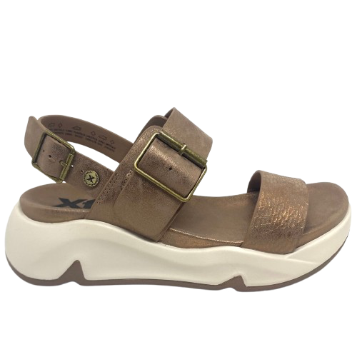 Super comfy and stylish, you'll have this sandal on high repeat all summer. Made with man made materials, it has a super comfy footbed with arch support and is adjustable across the instep and around the heel. The soft metallic finish has a skin pattern on the front strap and metallic detail on the wedge which both add to the look.