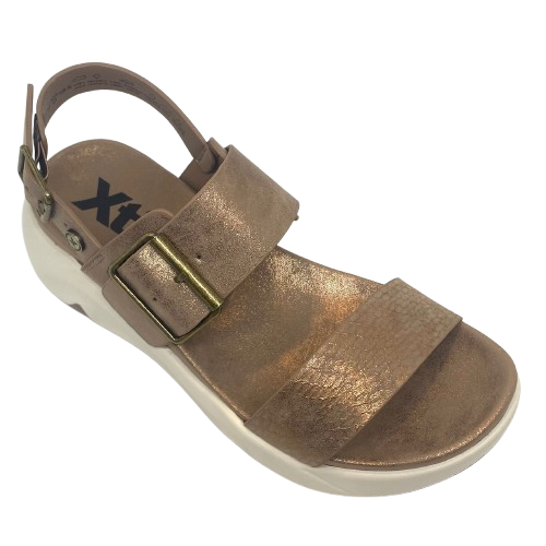 Super comfy and stylish, you'll have this sandal on high repeat all summer. Made with man made materials, it has a super comfy footbed with arch support and is adjustable across the instep and around the heel. The soft metallic finish has a skin pattern on the front strap and metallic detail on the wedge which both add to the look.