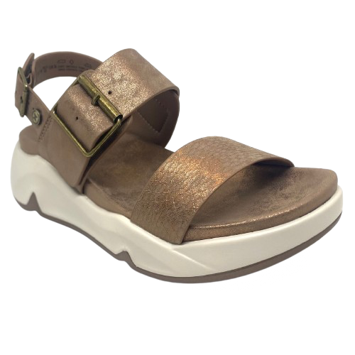 Super comfy and stylish, you'll have this sandal on high repeat all summer. Made with man made materials, it has a super comfy footbed with arch support and is adjustable across the instep and around the heel. The soft metallic finish has a skin pattern on the front strap and metallic detail on the wedge which both add to the look.