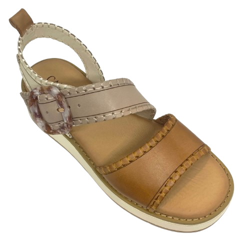 This comfortable little pair or flatform sandals in an interesting and versatile colour way of three tones of camel/beige/cream feature a "horn" look buckle and blanket stitched edges on the straps.