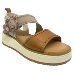 This comfortable little pair or flatform sandals in an interesting and versatile colour way of three tones of camel/beige/cream feature a "horn" look buckle and blanket stitched edges on the straps.