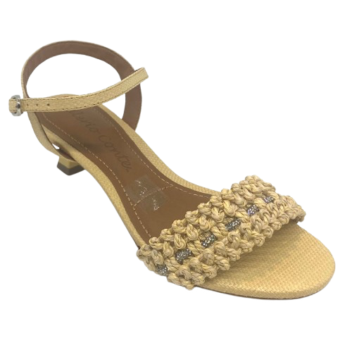 This pretty little sandal is made in a butter coloured "crocheted" raffia which has a comfortable width strap across the toes that features a tiny row of diamontes woven across it. The Y back provides good support and the 5cm kitten heel offers a dressed look while being a comfortable height. Made in Brazil.