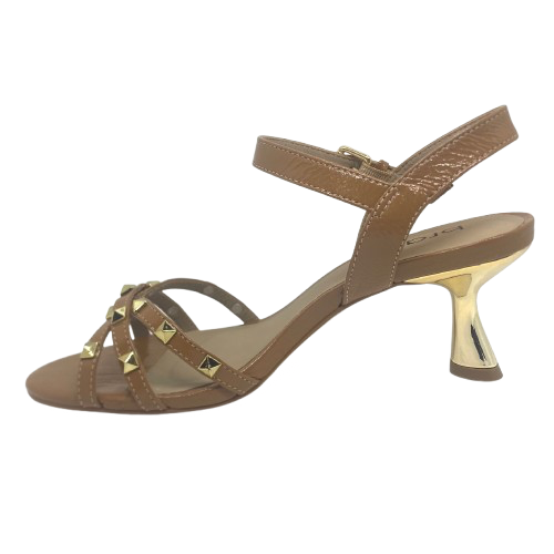 Tan isn't always a colour that looks "dressed" but here we have it in a patent leather trimmed with gold studs and a beautifully shaped 7cm gold heel. The crisscrossed straps across the toes offer good foot coverage and the Y back offers support. Made in Brazil.