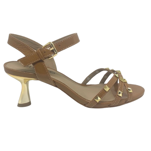 Tan isn't always a colour that looks "dressed" but here we have it in a patent leather trimmed with gold studs and a beautifully shaped 7cm gold heel. The crisscrossed straps across the toes offer good foot coverage and the Y back offers support. Made in Brazil.