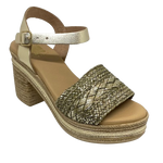 With it's retro flavour, light weight poly platform sole and metallic finish these little sandals could be you ultimate party shoe! Made in Spain.