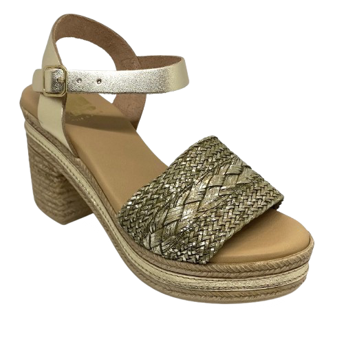 With it's retro flavour, light weight poly platform sole and metallic finish these little sandals could be you ultimate party shoe! Made in Spain.