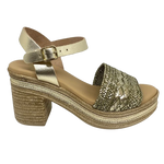 With it's retro flavour, light weight poly platform sole and metallic finish these little sandals could be you ultimate party shoe! Made in Spain.