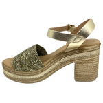 With it's retro flavour, light weight poly platform sole and metallic finish these little sandals could be you ultimate party shoe! Made in Spain.