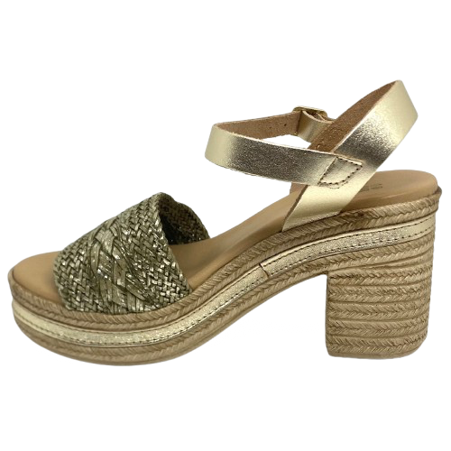 With it's retro flavour, light weight poly platform sole and metallic finish these little sandals could be you ultimate party shoe! Made in Spain.