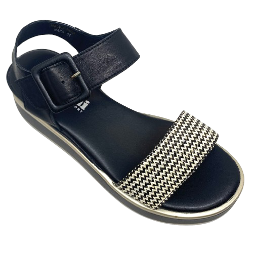 This low flatform wedge in black has a weave of both black and white in the front strap making it a versatile and interesting little sandal. A wide Y back gives plenty of support and is finished with a leather covered buckle. Made by Cassini.