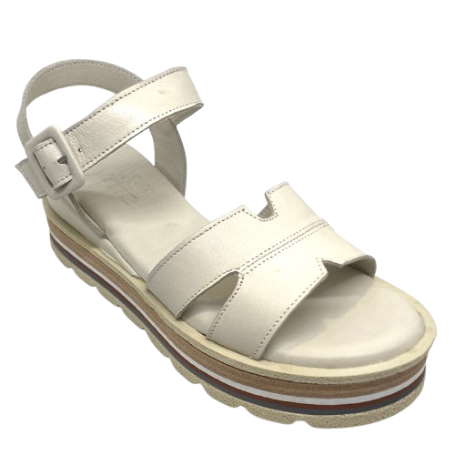 These soft and comfortable leather flatforms have support and style with their Y back, leather covered buckle and neutral striped wedge.